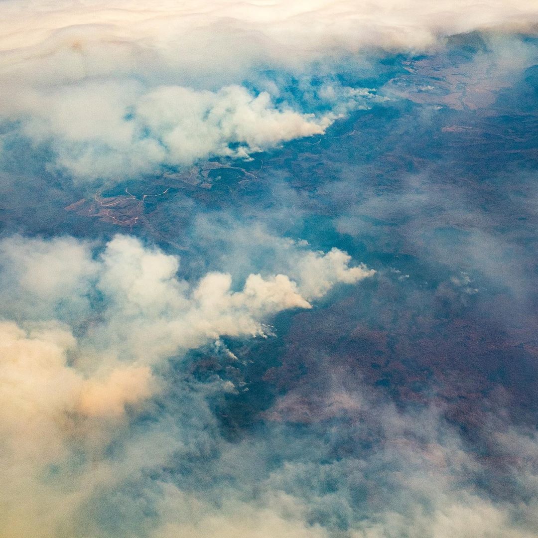 Flying over the bushfires at on my way to the USA. Down below: the border between NSW and Victoria, somewhere in the top right is Mallacoota. I watched as fire after fire added up until eventually the entire sky below me was a layer of smoke... clouds above, smoke below.