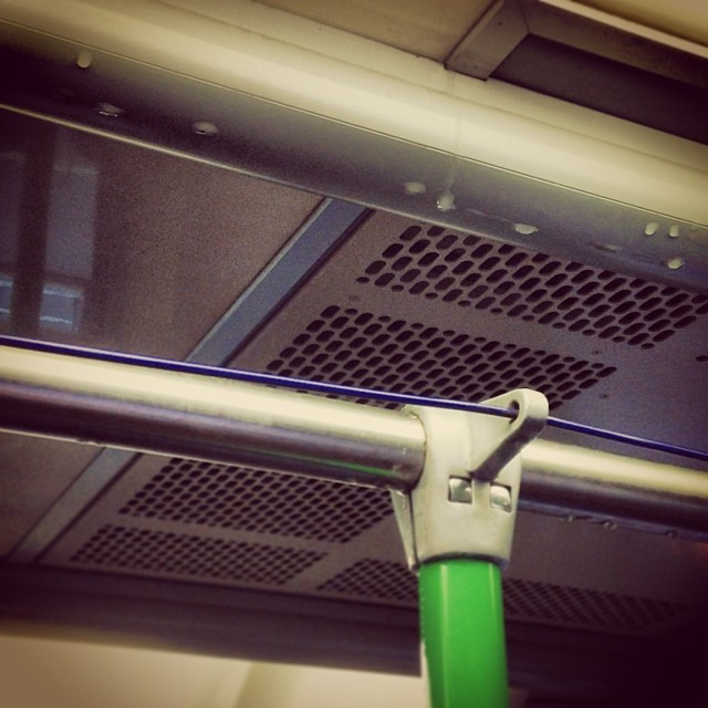 It's stopped raining outside, but no-one told the inside of this tram where the raindrops keep falling on my head.