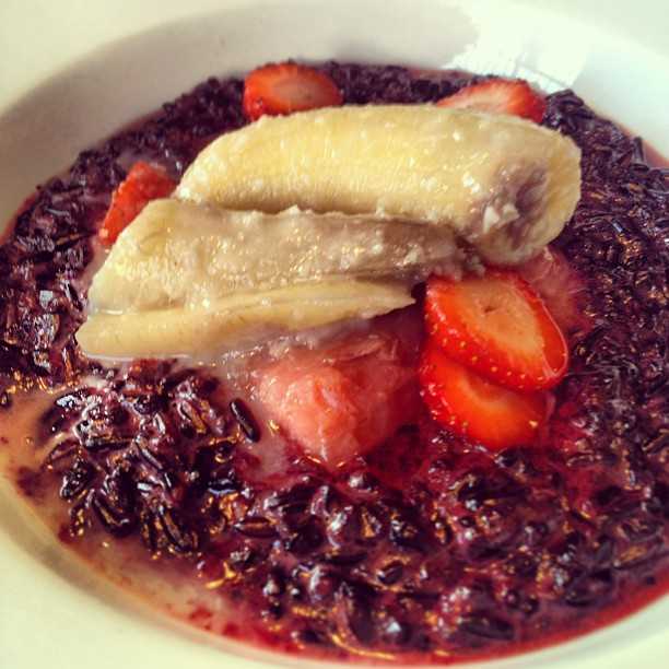 Black rice with coconut milk, banana, strawberry and rhubarb. Remind me to make this at home!