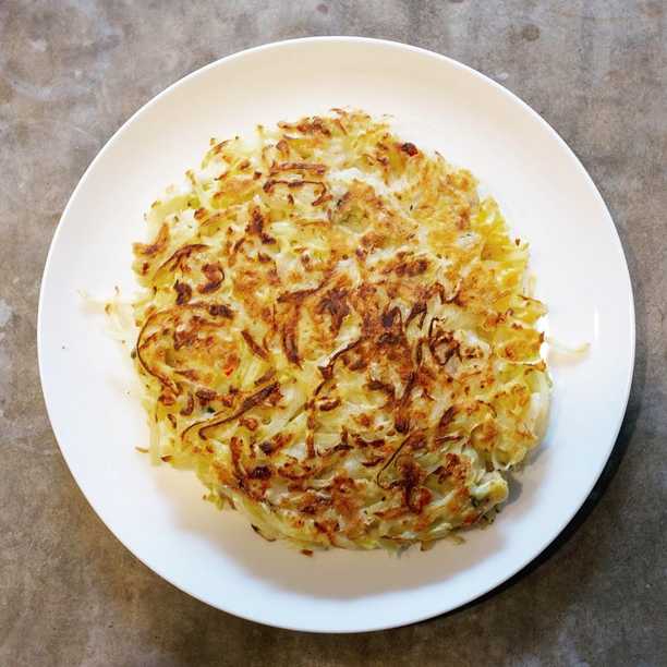 OK okonomiyaki fans, here is the recipe I used for today’s okonomiyaki pancake. The recipe varies depending on what I have around… I wouldn’t normally use onion but I have a lot right now so in it goes!

Ingredients:
* 200g cabbage
* 70g onion (half a small one)
* 5mm slice of ginger
* 75g flour
* 100ml water
* 1 egg
* A whole chilli
* A big spoonful of fried shallots
* Mysterious rice seasoning
* Vegetable oil (canola, peanut, etc)

To serve:
* Kewpie mayonnaise
* Otafuku okonomi sauce
* Shaved bonito

Start by chopping the vegetables finely. If the cabbage is chopped too coarse I find it doesn’t cook, so chop thin slices. 
In a mixing bowl add the flour and water (but not the egg), then mix it into a paste. I have a mysterious pack of Japanese rice seasoning so I added a spoonful here. Then mix in all the vegetables and fried shallots into the paste. Give it a good stir to make sure everything is coated. Then break an egg on top and mix it through.

Heat a frypan to a medium-high heat, with a little oil. My induction cooktop has heat levels 1 to 9, I use 7 for this. Spoon the mixture into the pan then flatten it out into a thick pancake shape. Cook for 6-7 minutes on one side, then flip over. Cook another 6-7 minutes on the other side.

Now the fun saucy part! Slide the okonomiyaki onto a plate. Squeeze some mayonnaise in lines across the whole pancake. Squeeze some okonomi sauce in lines in the other direction. Now throw a small handful of shaved bonito on top. Eat!